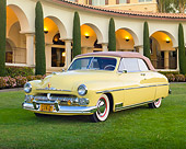 AUT 21 RK3122 01
1950 Mercury Convertible Light Yellow 3/4 Front View On Grass By Building