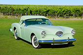 AUT 21 RK3134 01
1954 Kaiser Darrin Pine Tint Green 3/4 Front View On Grass By Vineyard