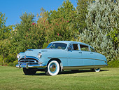 AUT 21 RK3188 01
1953 Hudson Super Wasp Blue 3/4 Front View On Grass By Trees