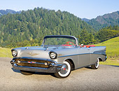 AUT 21 RK3206 01
1957 Chevrolet Bel Air Convertible Silver 3/4 Front View On Pavement By Evergreen Trees