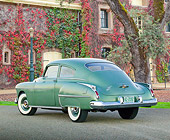 AUT 21 RK3212 01
1950 Oldsmobile Futuramic 88 Club Sedan Moss Green 3/4 Rear View On Pavement By Ivy Covered Building