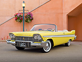 AUT 21 RK3232 01
1957 Plymouth Belvedere Convertible Canary Yellow 3/4 Front View On Pavement By Building And Lamp Post
