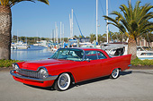 AUT 21 RK3235 01
1958 Chrysler Windsor Red 3/4 Front View On Pavement By Sailboats