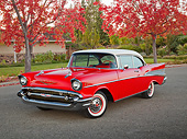 AUT 21 RK3256 01
1957 Chevrolet Bel Air Red With White Top 3/4 Front View On Pavement By House And Autumn Trees