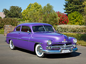 AUT 21 RK3284 01
1950 Mercury Coupe Pearl Purple 3/4 Front View On Pavement By Trees And Shrubs