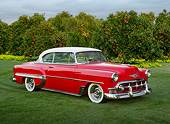 AUT 21 RK3287 01
1953 Chevrolet Bel Air Torch Red 3/4 Front View On Grass By Orange Trees