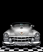 AUT 21 RK3289 01
1953 Cadillac Eldorado Convertible Silver Front View On Checkered Floor Background