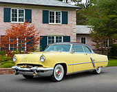 AUT 21 RK3293 01
1953 Lincoln Capri Yellow 3/4 Front View On Pavement By Brick House