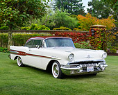 AUT 21 RK3297 01
1957 Pontiac Star Chief White And Red 3/4 Front View On Grass By Trees And Gate
