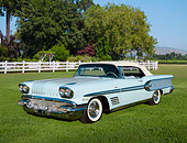 AUT 21 RK3299 01
1958 Pontiac Bonneville Two-Tone Blue 3/4 Front View On Grass By Trees And White Fence