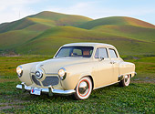 AUT 21 RK3313 01
1951 Studebaker Champion Yellow 3/4 Front View On Grass By Hills