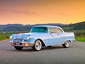 AUT 21 BK0006 01
1955 Pontiac Chieftan White 3/4 Front View On Pavement By Hills At Dusk