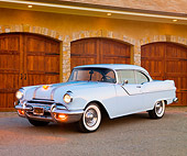 AUT 21 BK0007 01
1955 Pontiac Chieftan White 3/4 Front View On Pavement By Hills At Dusk