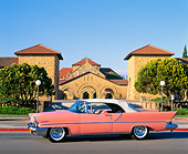 AUT 21 RK0090 11
1957 Lincoln Premier Pink 3/4 Front View On Road In Front Of Building