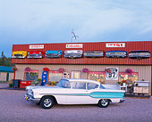 AUT 21 RK0095 04
1958 White & Lt Blue Pontiac Chieftain 3/4 Side Front Of Trading Post Store Lights On