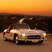 AUT 21 RK0122 05
1956 Mercedes-Benz 300SL Gullwing Silver Doors Up Front 3/4 Front View On Pavement Filtered