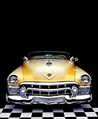 AUT 21 RK0154 12
1953 Yellow Cadillac Eldorado Convertible Top Down Head On Shot On Checkerboard Studio Background