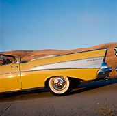 AUT 21 RK0226 01
1957 Yellow Chevy Bel Air Rear Tail Finn Shot On Pavement Blue Sky