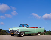 AUT 21 RK0234 09
1954 Light Green Cadillac Convertible 3/4 Side View On Pavement Blue Sky