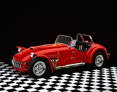 AUT 21 RK0238 02
1954 Red Kurtis-Kraft 500-S Roadster Convertible 3/4 Front On Checkerboard Floor Studio