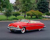 AUT 21 RK0283 04
1951 Red Lincoln Convertible Cosmopolitan 3/4 Side View On Pavement By Trees And Grass