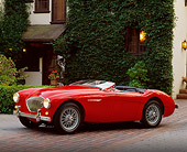 AUT 21 RK0285 02
1954 Austin-Healey 100-4 BN2 Convertible Red 3/4 Side View On Driveway