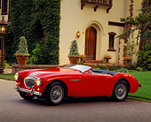 AUT 21 RK0285 11
1954 Austin-Healey 100-4 BN2 Convertible Red 3/4 Side View On Driveway