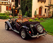AUT 21 RK0288 04
1952 MG TD Convertible Black 3/4 Rear View On Driveway