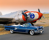 AUT 21 RK0295 02
1958 Pontiac Bonneville Convertible Blue 3/4 Side View On Pavement By Airplane