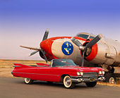AUT 21 RK0298 04
1959 Cadillac Series 62 Convertible Red 3/4 Front On Pavement By Airplane