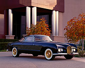 AUT 21 RK0358 01
1953 Cadillac Ghia Coupe Black 3/4 Side View By Building And Fall Trees