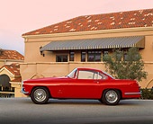AUT 21 RK0363 07
1957 Jaguar XK-140 Red 3/4 Front View On Pavement By Building