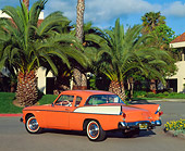 AUT 21 RK0393 03
1958 Orange Studebaker Commander 3/4 Rear View On Pavement By Palm Trees