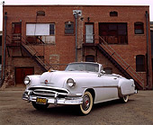 AUT 21 RK0404 02
1954 Pontiac Starchief Convertible White 3/4 Front View In Front Of Brick Building