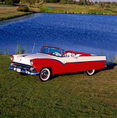 AUT 21 RK0422 05
1955 Ford Sunliner Convertible Red And White Side 3/4 View On Grass By Lake