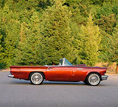 AUT 21 RK0435 09
1957 Cinnamon Ford T-Bird Convertible Side View On Pavement By Trees