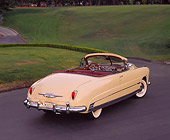 AUT 21 RK0455 03
1950 Hudson Commodore Convertible Yellow 3/4 Rear View On Pavement By Grass