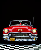 AUT 21 RK0475 02
1956 Red Cadillac Convertible Head On View On Checkerboard Headlights On Studio