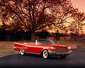 AUT 21 RK0498 09
1959 Chrysler 300E Convertible Red 3/4 Front View On Pavement  Headlights On Filtered
