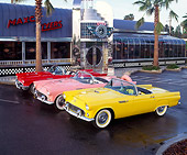 AUT 21 RK0509 08
55, 56, & 57 Ford T-Birds 3/4 Front View On Pavement By Diner