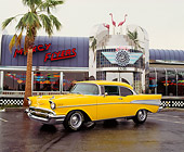 AUT 21 RK0540 02
1957 Yellow Chevy Bel Air 3/4 Front View On Pavement By Diner