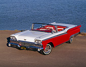AUT 21 RK0544 07
1959 Red/White Ford Fairlane, 3/4 front on pavement with water in background, top down
