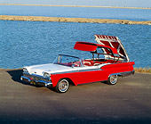 AUT 21 RK0545 06
1959 Red/White Ford Fairlane Roof Retracting 3/4 Front View On Pavement By Water