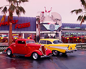 AUT 21 RK0546 36
1957 Yellow Chevy Bel Air & 1932 Ford Coupe, 3/4 rear and 3/4 front in front of diner