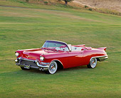 AUT 21 RK0562 11
1957 Cadillac Biarritz Convertible Red 3/4 Front View On Grass