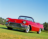 AUT 21 RK0564 05
1957 Cadillac Biarritz Convertible Red 3/4 Front View On Grass