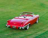 AUT 21 RK0564 08
1957 Cadillac Biarritz Convertible Red 3/4 Front View On Grass