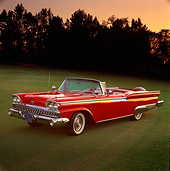 AUT 21 RK0594 01
1959 Ford Fairlane Convertible Red 3/4 Side View On Grass By Trees At Dusk