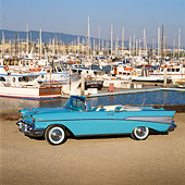 AUT 21 RK0608 06
1957 Chevrolet Bel Air Convertible Light Blue 3/4 Front View On Gravel By Marina Blue Sky
