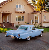 AUT 21 RK0628 05
1957 Ford Thunderbird Powder Blue 3/4 Rear View On Pavement In Front Of House